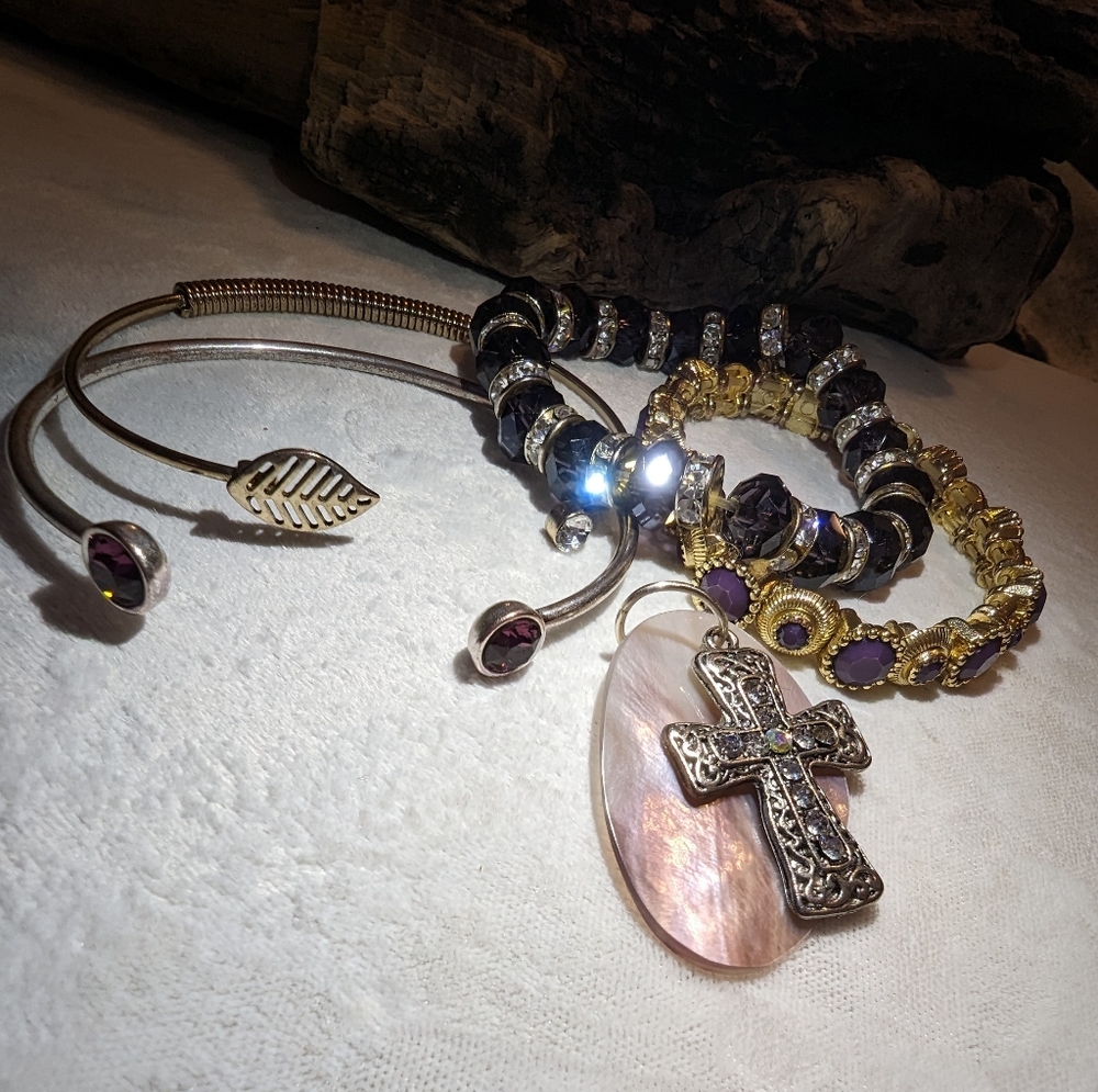 Cross and abalone pendents, with four bracelets..
